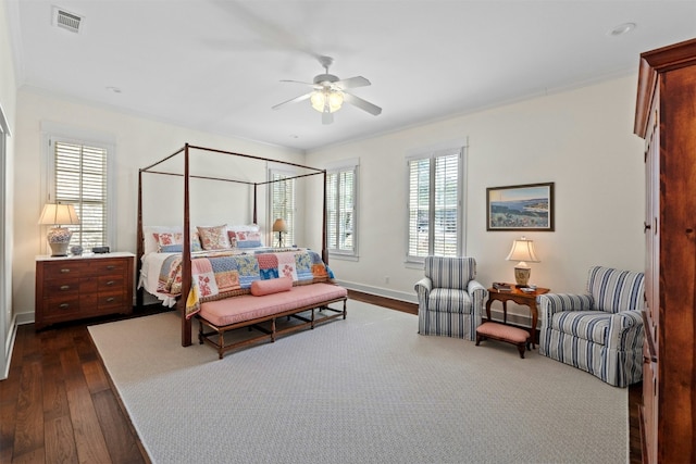 bedroom with baseboards, visible vents, a ceiling fan, dark wood finished floors, and crown molding