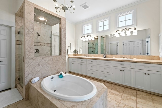 full bathroom featuring visible vents, vanity, a bath, a stall shower, and crown molding