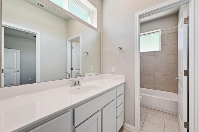 full bathroom featuring toilet, tile patterned flooring, visible vents, and vanity