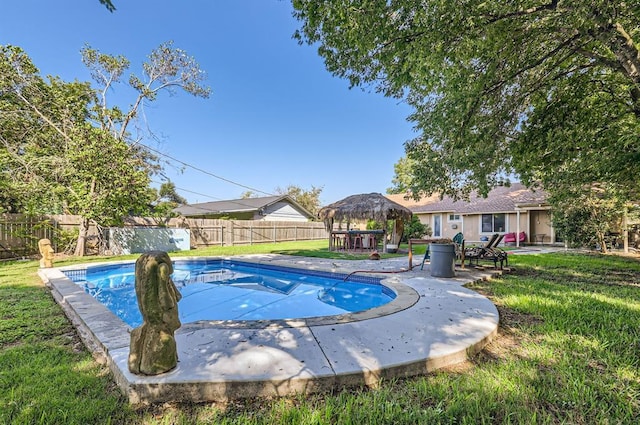 view of swimming pool featuring a yard, a patio area, a fenced backyard, and a fenced in pool