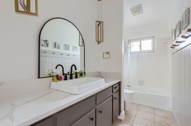 bathroom with bathing tub / shower combination, visible vents, toilet, vanity, and tile patterned floors