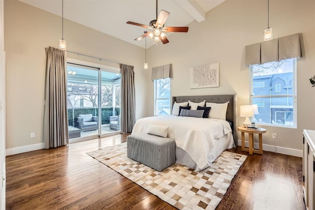 bedroom featuring access to exterior, baseboards, and wood finished floors