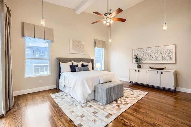 bedroom featuring dark wood-type flooring, beamed ceiling, high vaulted ceiling, and baseboards