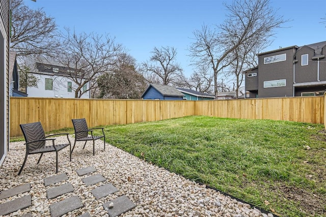 view of yard featuring a patio area and a fenced backyard