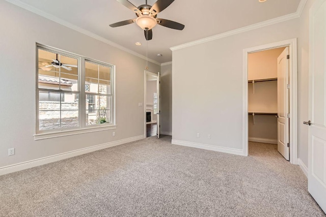 304 Belforte Ave, Austin, TX 78734 - unfurnished bedroom featuring carpet, ornamental molding, a walk in closet, baseboards, and recessed lighting