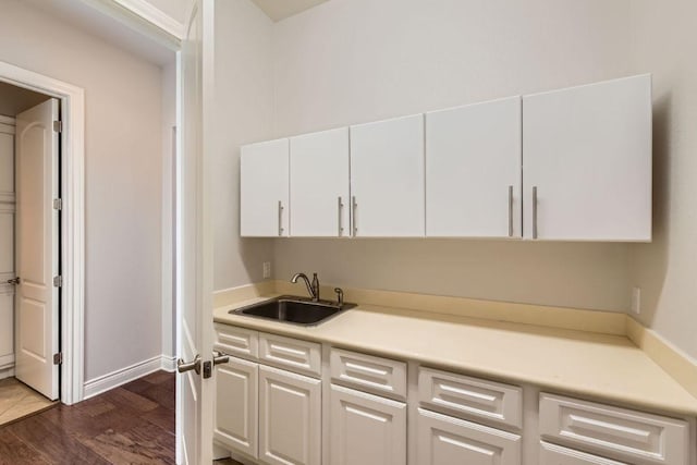 304 Belforte Ave, Austin, TX 78734 - kitchen featuring a sink, white cabinets, light countertops, and dark wood-style floors