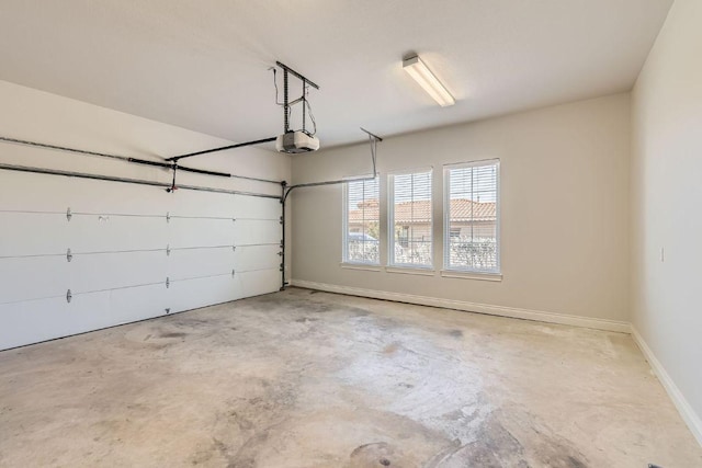 304 Belforte Ave, Austin, TX 78734 - garage with a garage door opener and baseboards