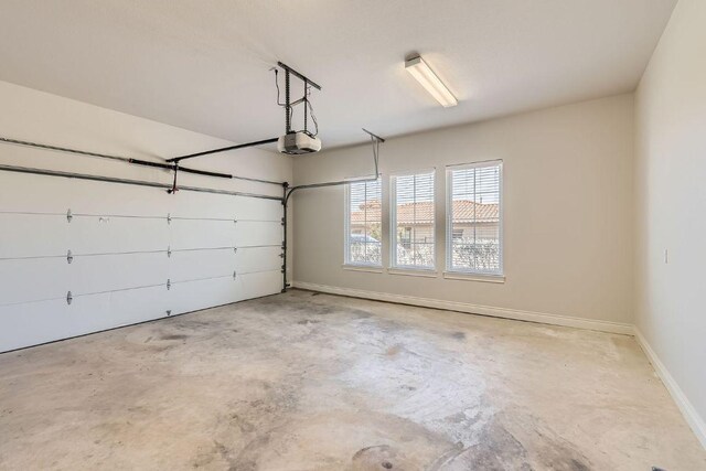 304 Belforte Ave, Austin, TX 78734 - garage with a garage door opener and baseboards
