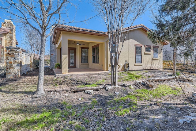 304 Belforte Ave, Austin, TX 78734 - rear view of house featuring ceiling fan, stucco siding, a patio area, and a tile roof