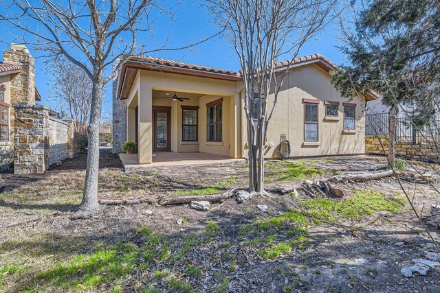 304 Belforte Ave, Austin, TX 78734 - rear view of house featuring ceiling fan, stucco siding, a patio area, and a tile roof