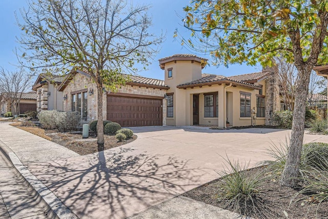 304 Belforte Ave, Austin, TX 78734 - mediterranean / spanish-style home featuring stucco siding, a tile roof, a garage, driveway, and stone siding