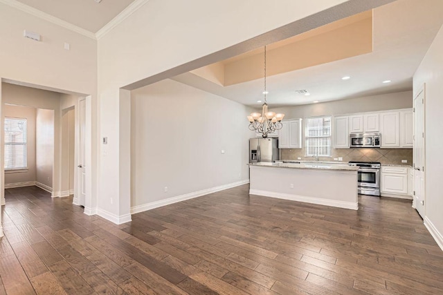 304 Belforte Ave, Austin, TX 78734 - kitchen with stainless steel appliances, dark wood-type flooring, a chandelier, white cabinets, and recessed lighting