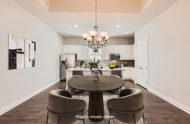 304 Belforte Ave, Austin, TX 78734 - dining space featuring a chandelier, dark wood finished floors, recessed lighting, and baseboards