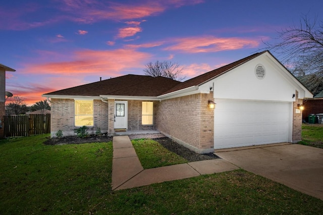 single story home with an attached garage, brick siding, fence, concrete driveway, and a yard