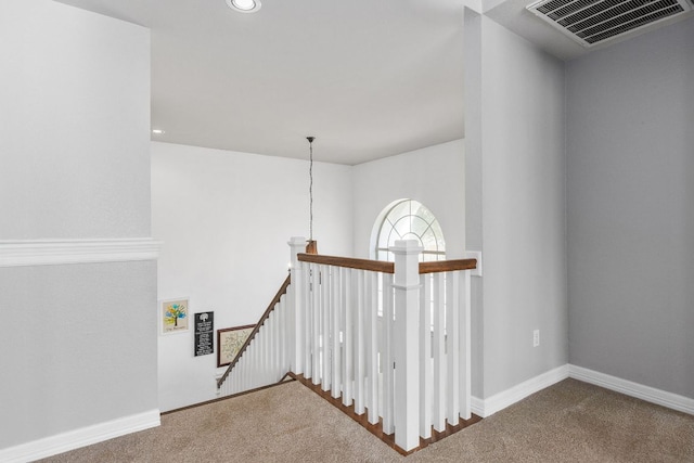 staircase featuring carpet, visible vents, baseboards, and recessed lighting