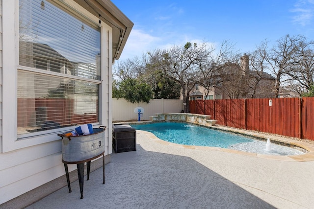 view of swimming pool featuring a patio area, a fenced backyard, and a fenced in pool