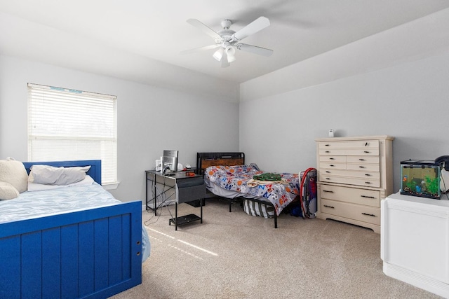 bedroom featuring a ceiling fan and light colored carpet