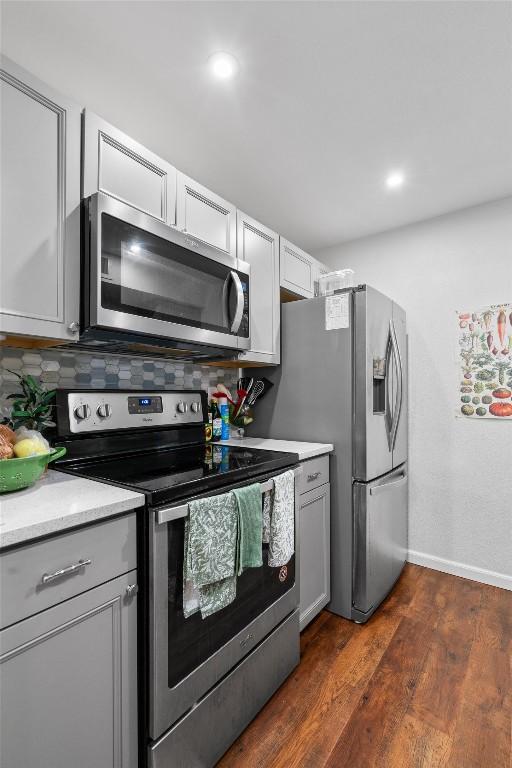 2401 Leon St Unit 208, Austin, TX 78705 - kitchen featuring gray cabinetry, appliances with stainless steel finishes, and light countertops