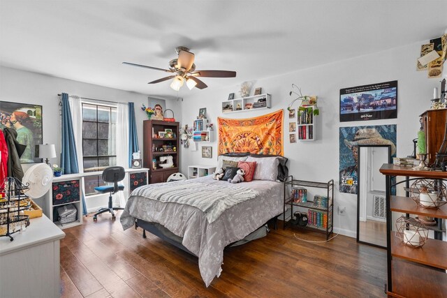 2401 Leon St Unit 208, Austin, TX 78705 - bedroom featuring baseboards, ceiling fan, and wood finished floors