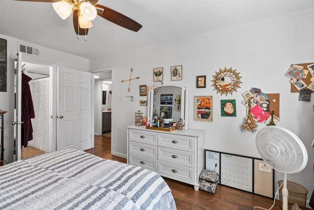 2401 Leon St Unit 208, Austin, TX 78705 - bedroom featuring ceiling fan, dark wood-style floors, and visible vents