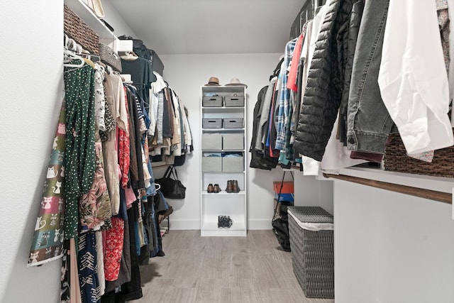 spacious closet with wood finished floors