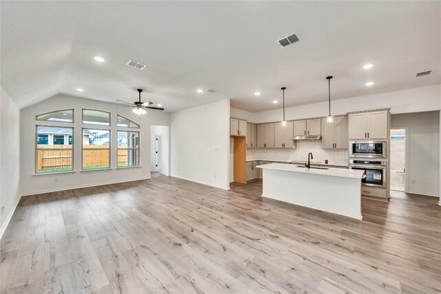 148 Rocky View Ln, Georgetown, TX 78628 - kitchen with stainless steel appliances, light countertops, open floor plan, recessed lighting, and tasteful backsplash