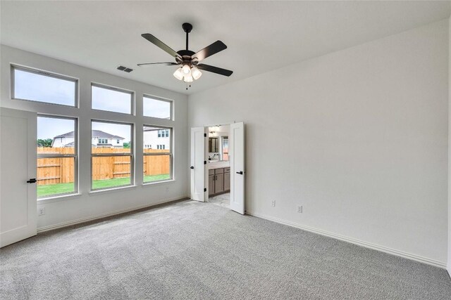 148 Rocky View Ln, Georgetown, TX 78628 - unfurnished room with light colored carpet and ceiling fan