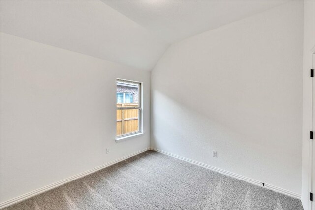 148 Rocky View Ln, Georgetown, TX 78628 - additional living space with carpet and vaulted ceiling