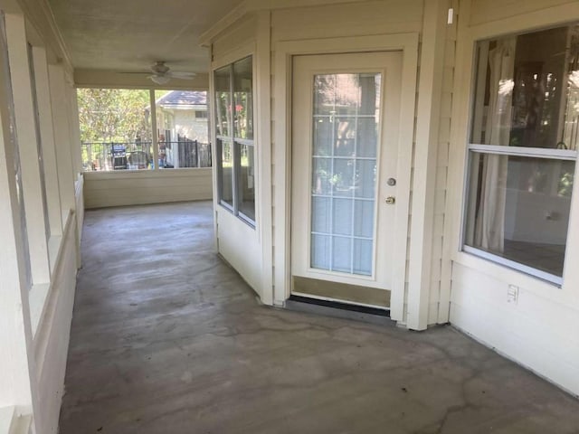 property entrance featuring ceiling fan