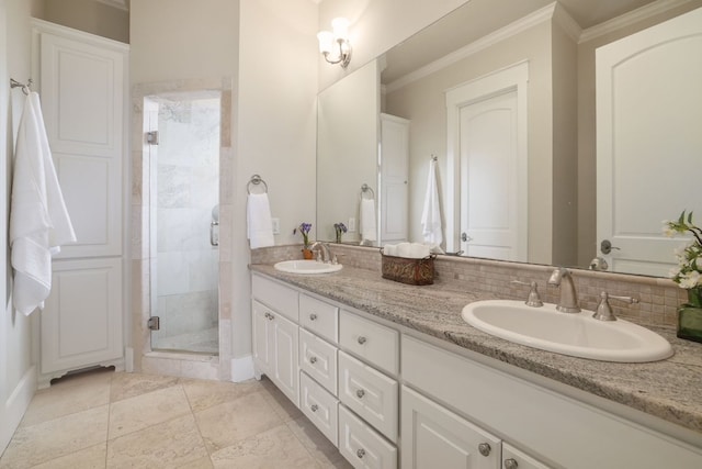 bathroom featuring crown molding, a stall shower, a sink, and double vanity