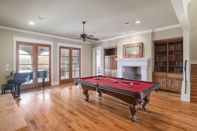 playroom with light wood-style floors, visible vents, and french doors