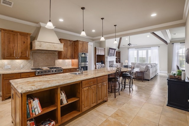 kitchen featuring stainless steel appliances, custom range hood, visible vents, decorative backsplash, and brown cabinetry