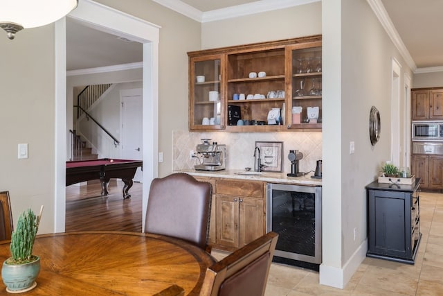 bar featuring wine cooler, ornamental molding, stairway, decorative backsplash, and stainless steel microwave