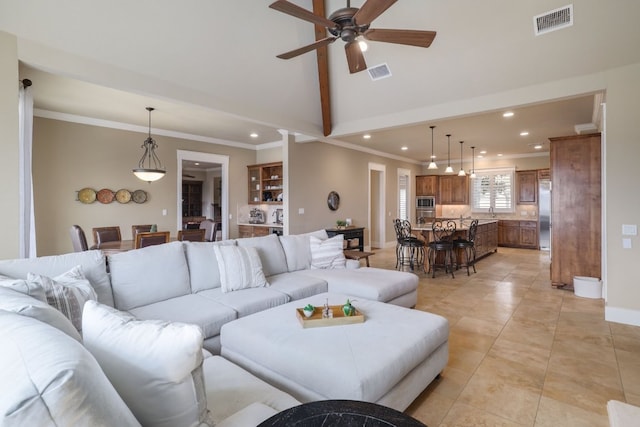 living room featuring ornamental molding, recessed lighting, visible vents, and light tile patterned floors