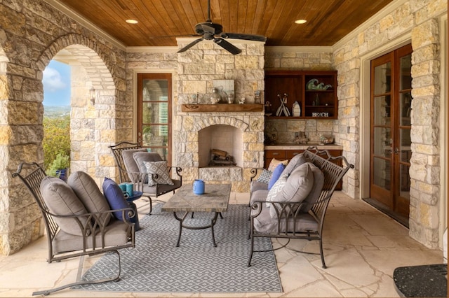 view of patio with french doors and an outdoor living space with a fireplace