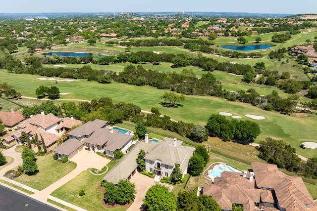 birds eye view of property featuring a water view, view of golf course, and a residential view