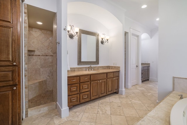 full bathroom featuring recessed lighting, walk in shower, a tub to relax in, and vanity