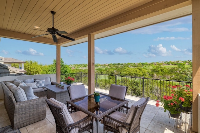 view of patio / terrace with an outdoor living space, a ceiling fan, and outdoor dining area