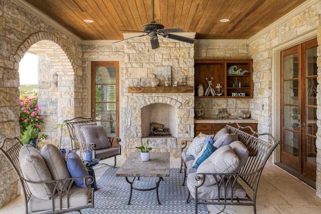 living room with crown molding, stone tile floors, ceiling fan, recessed lighting, and wood ceiling