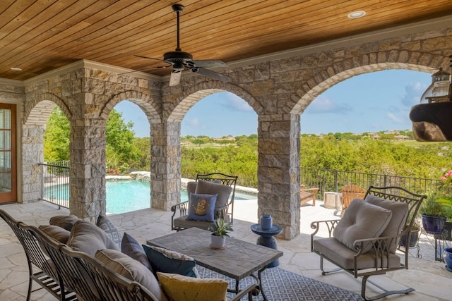 view of patio featuring a fenced in pool, ceiling fan, and outdoor lounge area