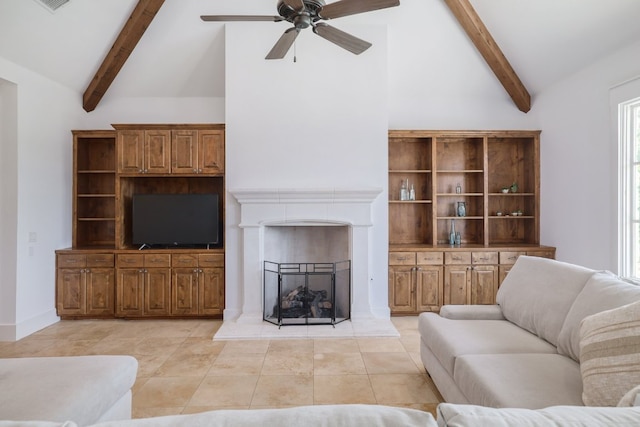 living room featuring beam ceiling, high vaulted ceiling, a fireplace with raised hearth, a ceiling fan, and light tile patterned floors