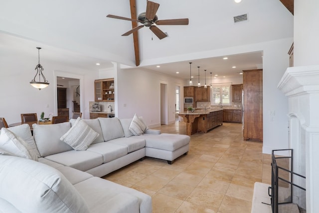 living room featuring high vaulted ceiling, recessed lighting, a ceiling fan, light tile patterned floors, and visible vents