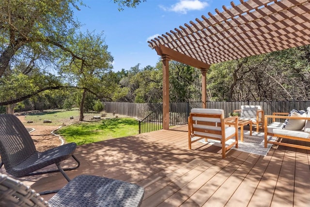 wooden terrace featuring fence, outdoor lounge area, a pergola, and a yard