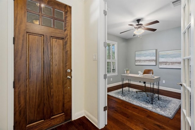 entryway with visible vents, dark wood finished floors, and baseboards