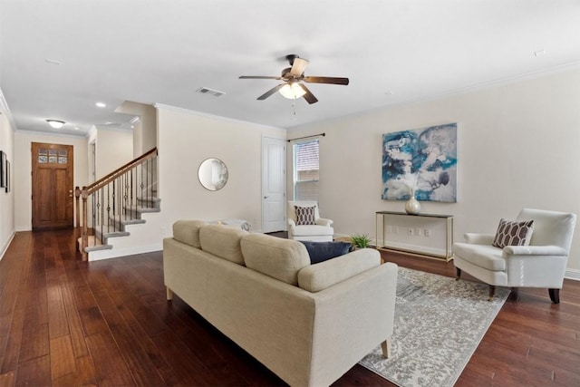 living area with dark wood finished floors, visible vents, a ceiling fan, baseboards, and stairs