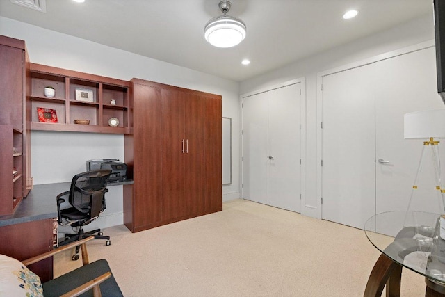 office featuring recessed lighting, built in study area, and light colored carpet