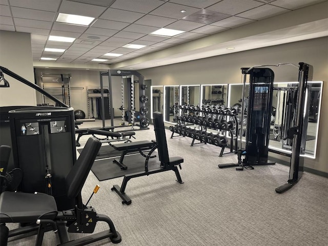 workout area featuring a paneled ceiling