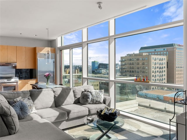 living area featuring expansive windows and a city view