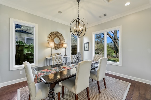 dining space featuring visible vents, baseboards, ornamental molding, wood finished floors, and a notable chandelier