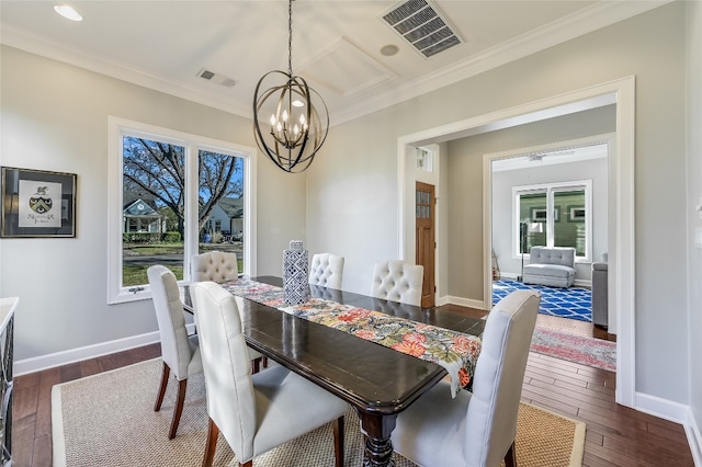 dining room with dark wood-style flooring, visible vents, and baseboards